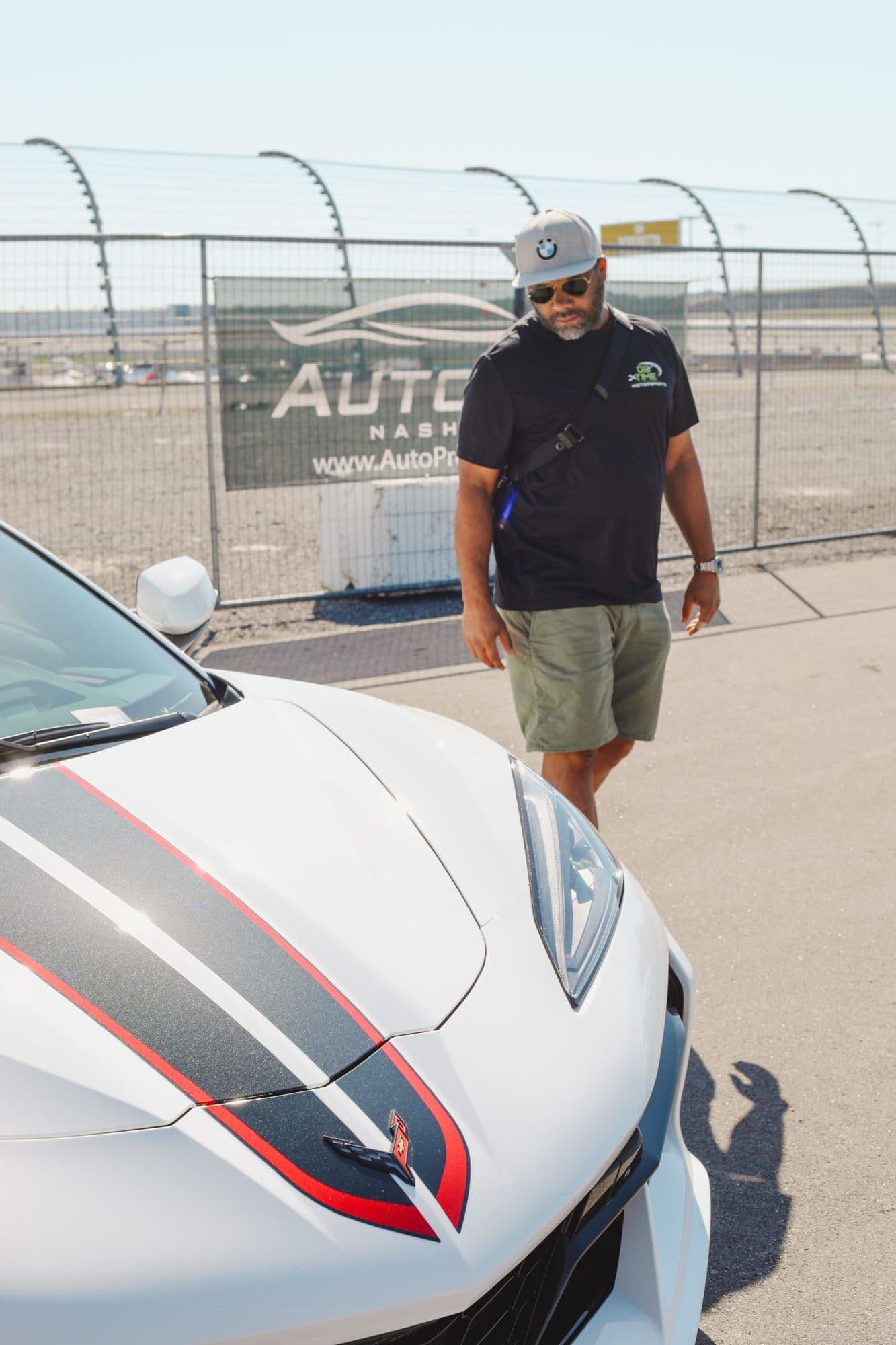 Gavin Brooks beside a liveried Ferrari at a Nashville track day